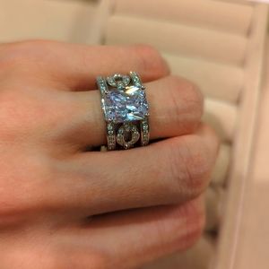 Cubic zirconia engagement style ring with removable pave set chain link band.